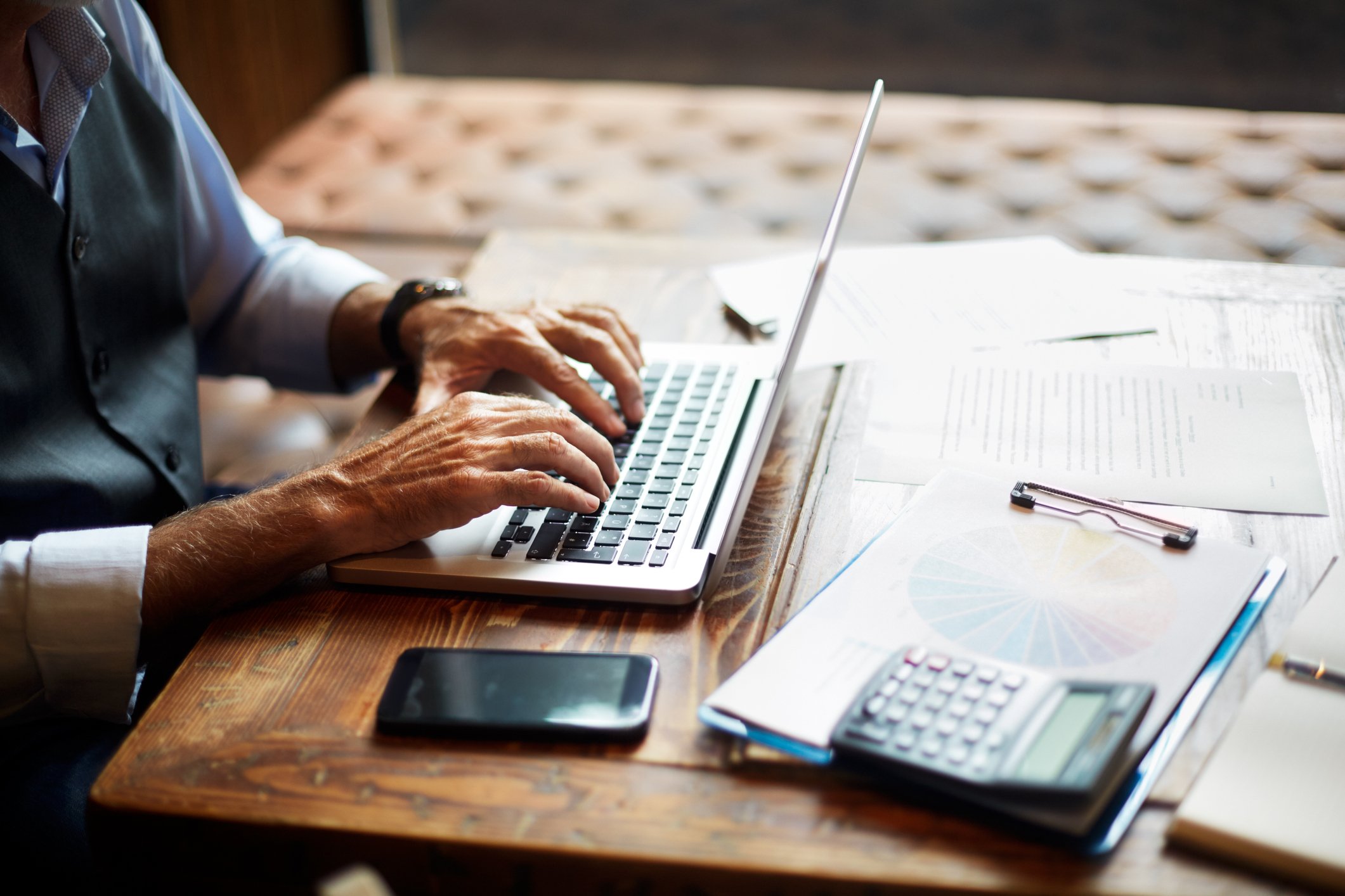 Older Man working on a laptop