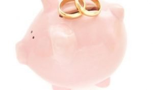 wedding rings on piggy bank